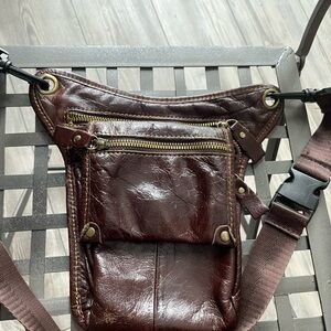 Leather crossbody sling bag—compact, dark brown, 3 zips.